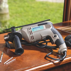 Furadeira de Impacto Tramontina 1/2" com Empunhadura Auxiliar e Sistema de Reversão - 500W - 220V - 1