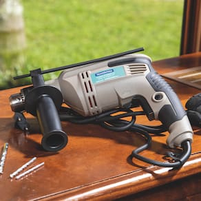 Furadeira de Impacto Tramontina 1/2" com Empunhadura Auxiliar e Sistema de Reversão - 500W - 110V - 1