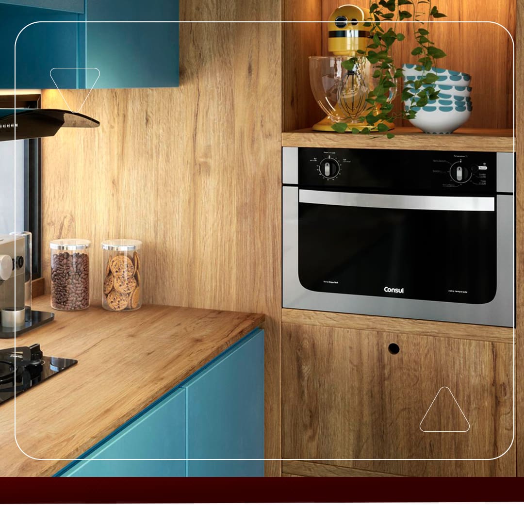 Forno Elétrico Consul embutido prata cinza preto dois botões móvel parede madeira marrom potes folha verde objeto decorativo pote grãos café exaustor cooktop porta azul