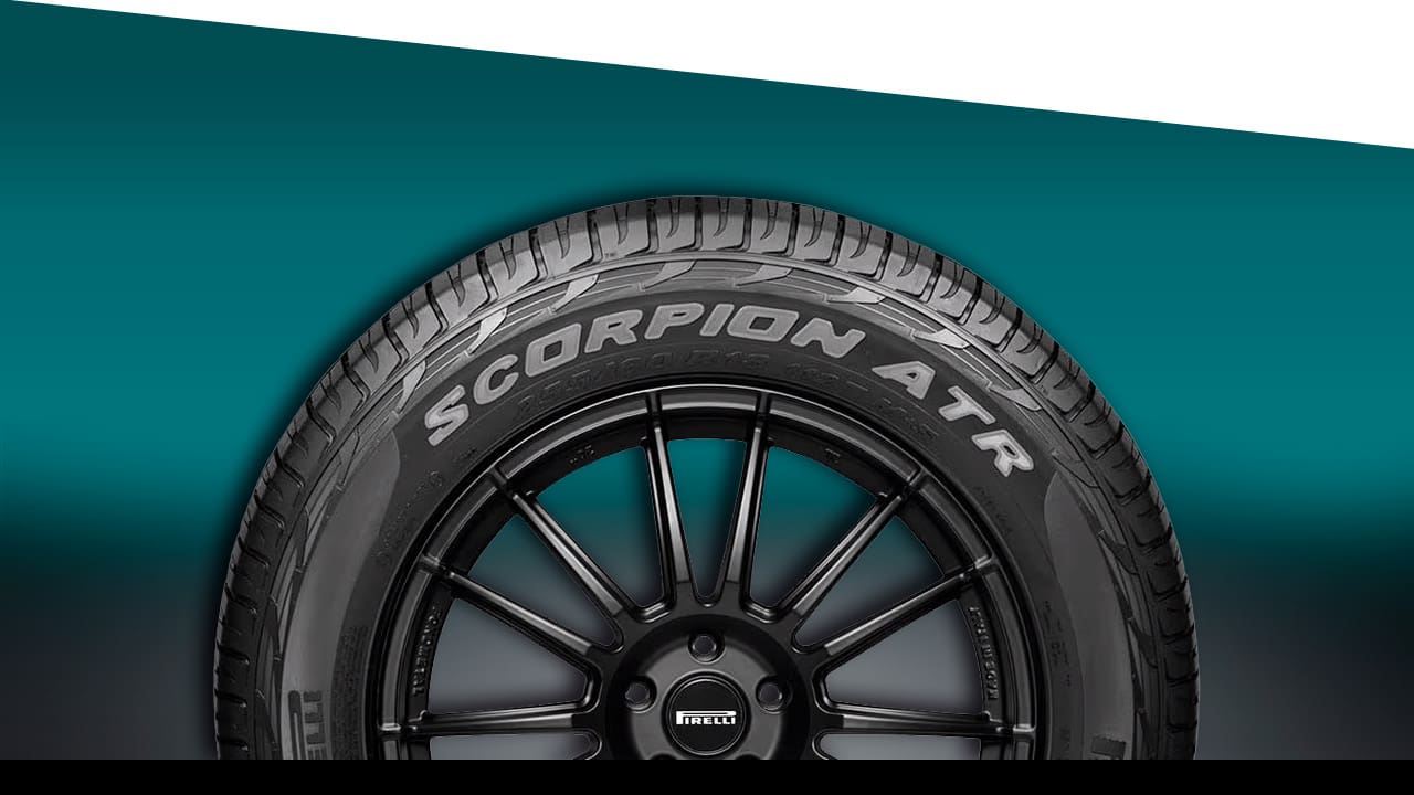 imagem frontal frente Pneu Pirelli Scorpion ATR preto fundo verde  